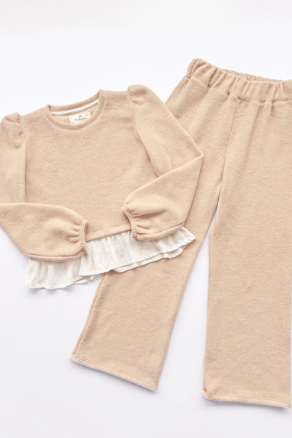 CONJUNTO CHOMPERO CON MANGAS ABULLONADAS Y FALDON DE LINO Y BUZO PALAZO