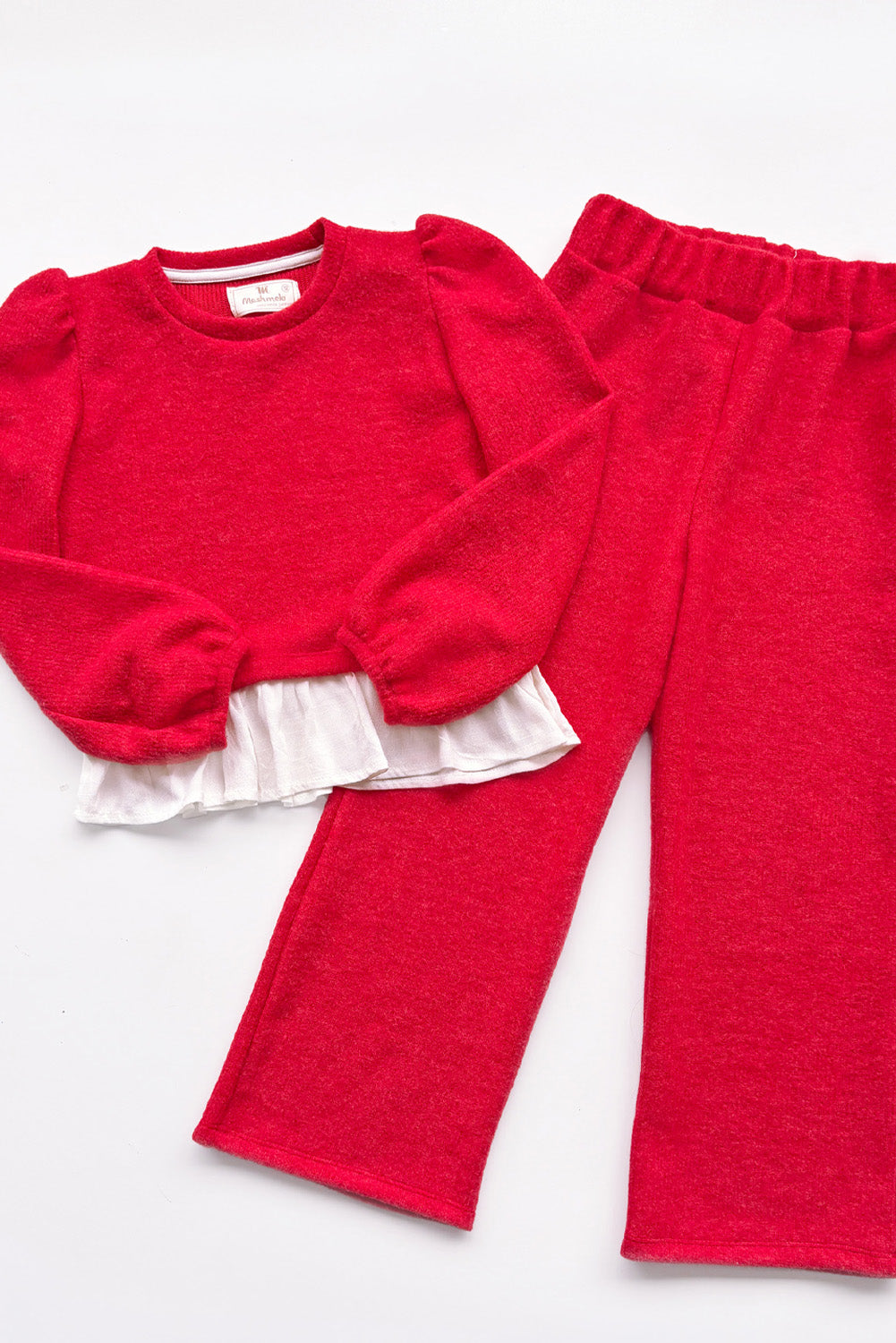 CONJUNTO CHOMPERO CON MANGAS ABULLONADAS Y FALDON DE LINO Y BUZO PALAZO