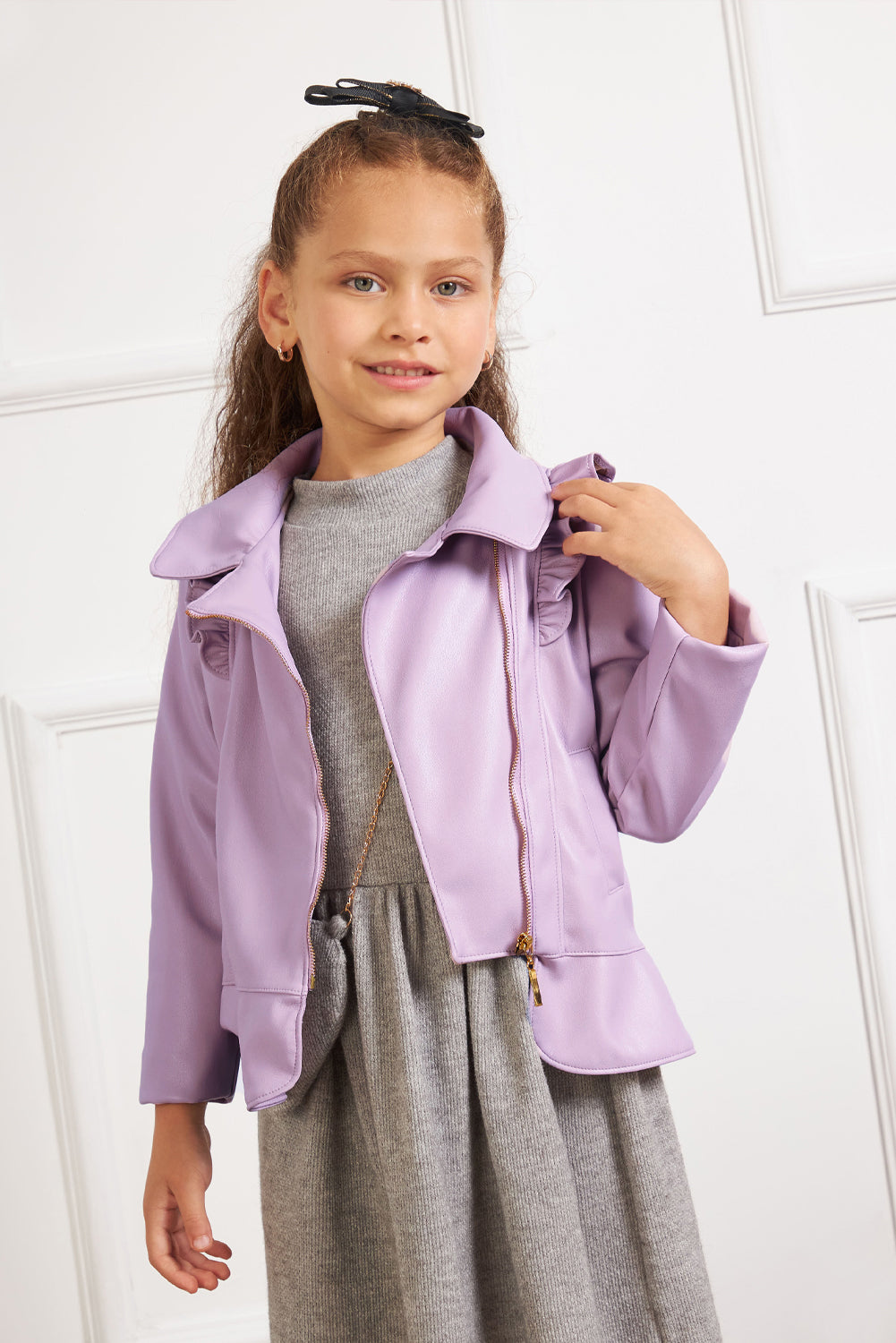 Chaqueta en cuerina con volantes