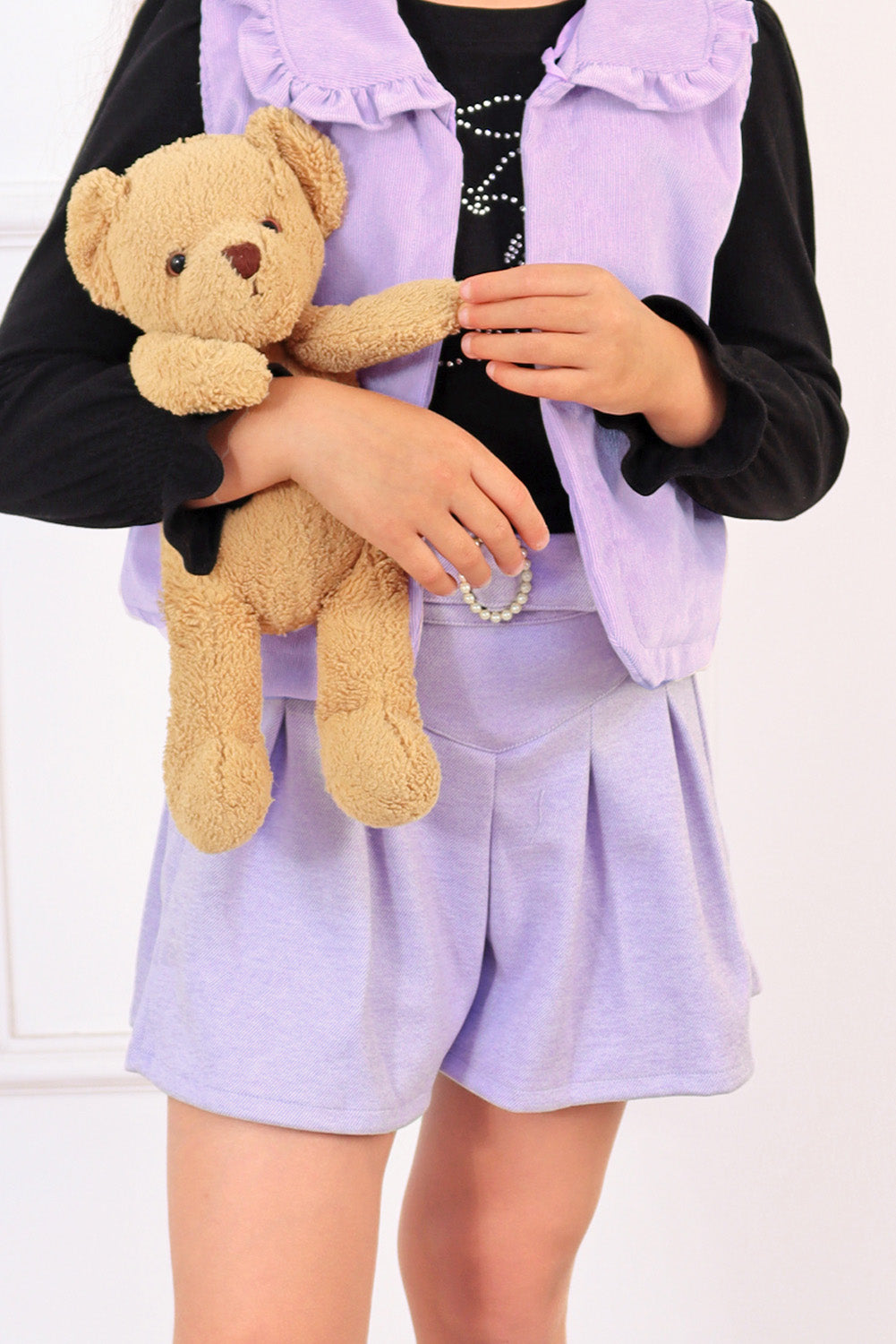 Falda short tableada con detalle en la pretina