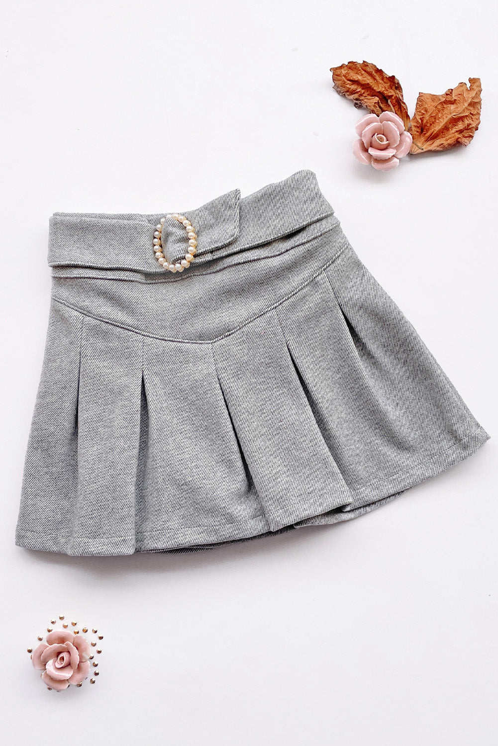 Falda short tableada con detalle en la pretina