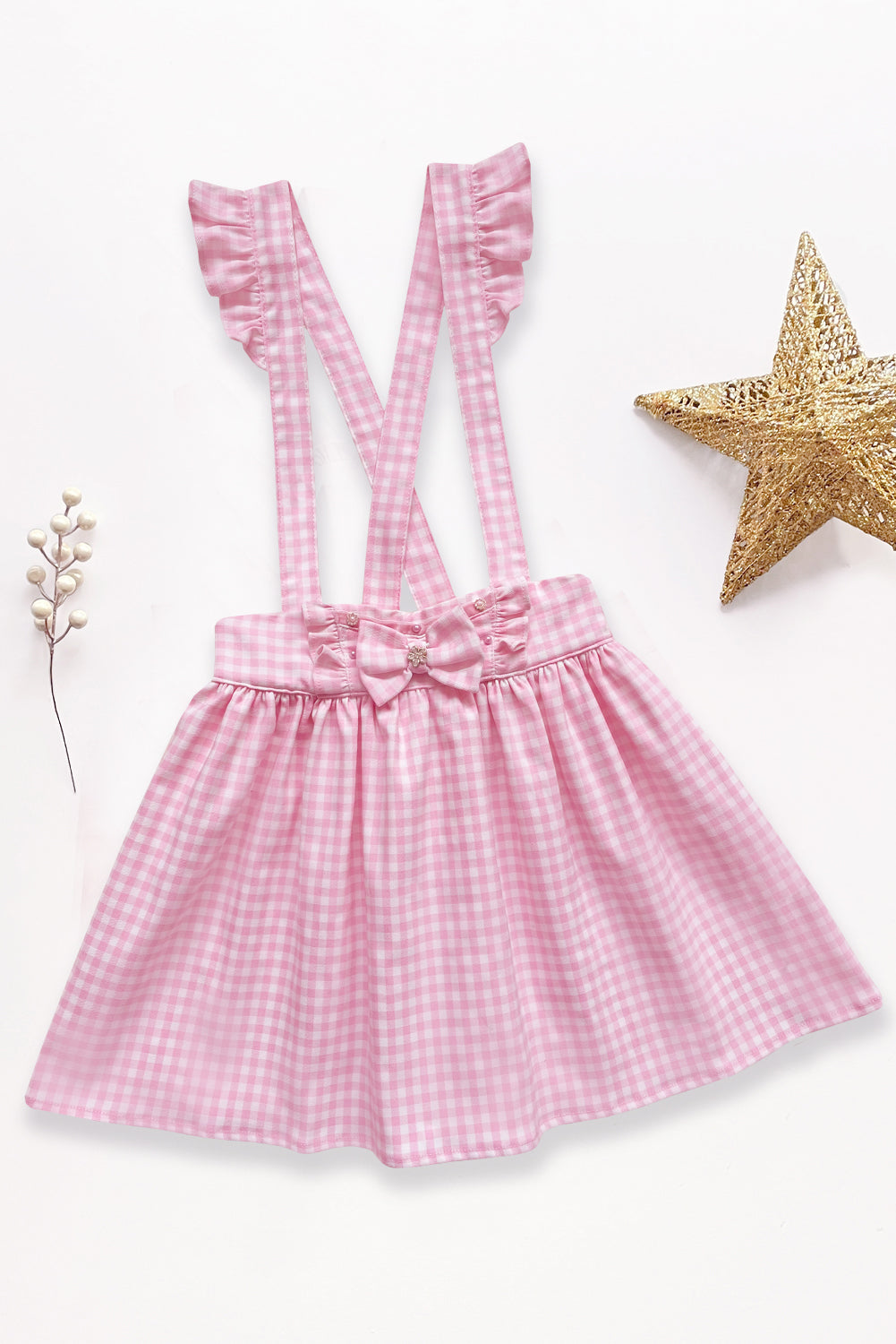 Jumper a cuadros con volantes y lazo