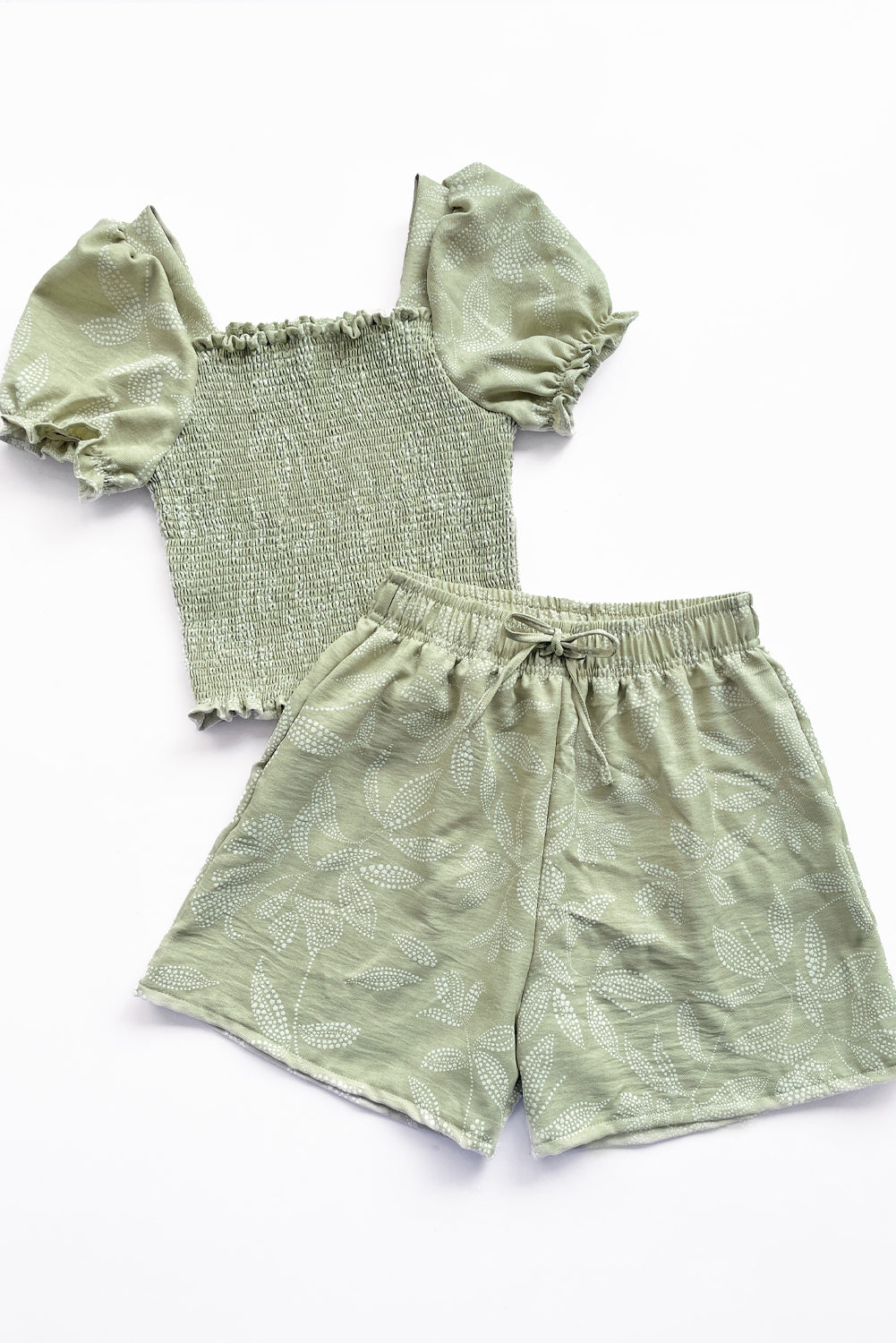 Set de blusa multiaguja y short con bolsillos