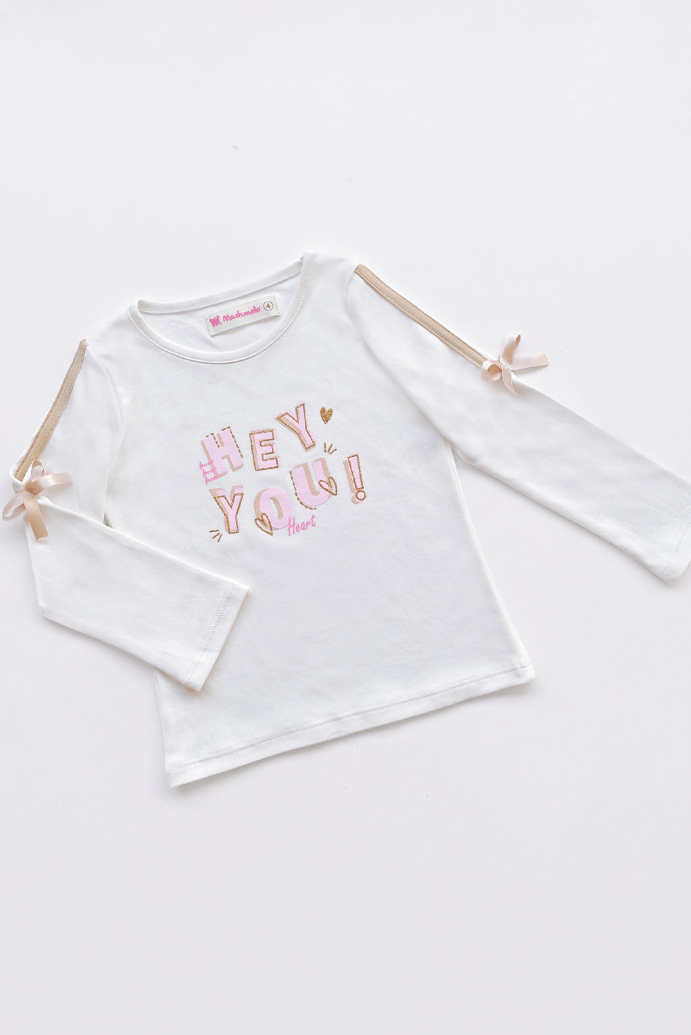 POLO ESTAMPADO CON TAPETE Y LAZITOS EN MANGAS