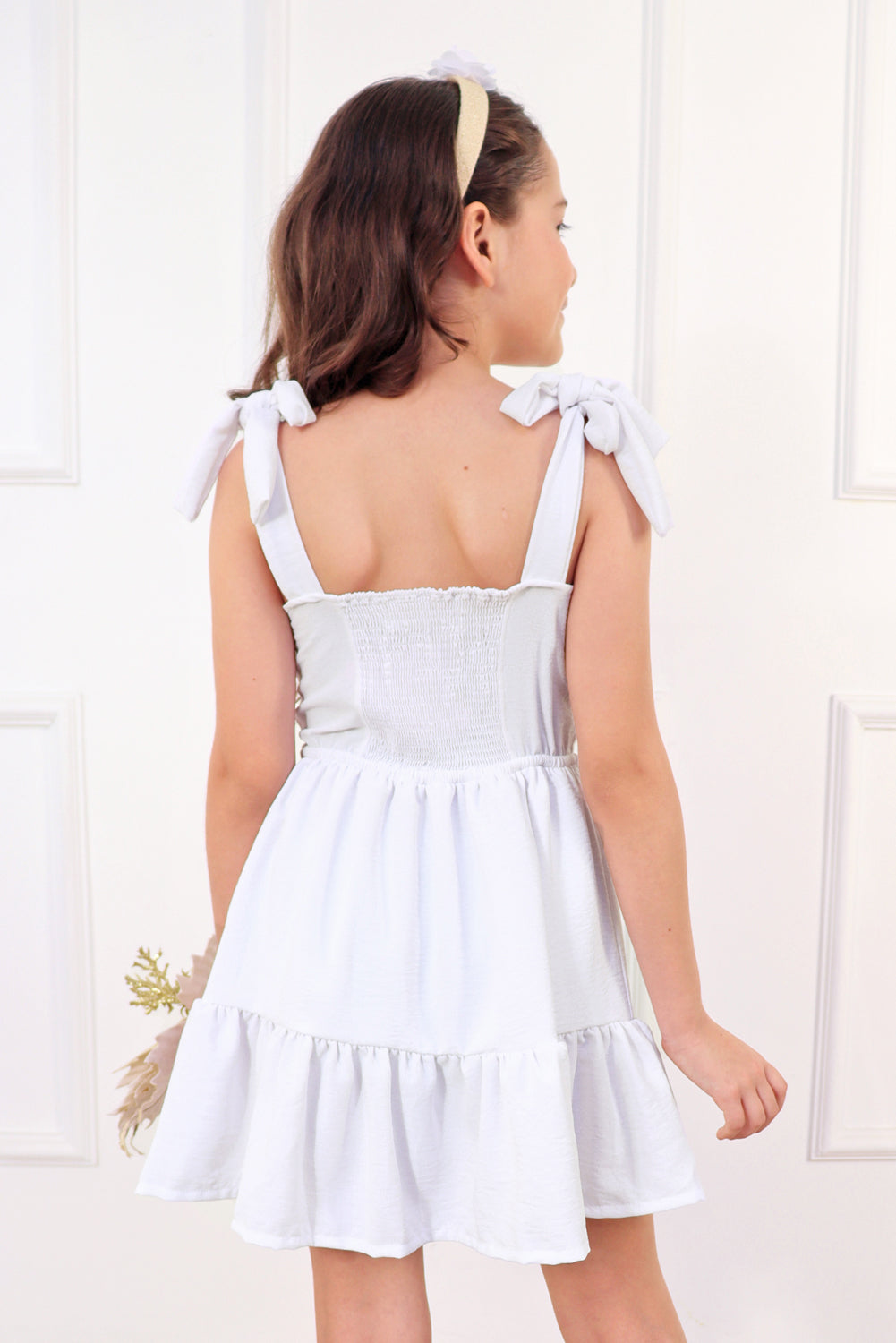 Vestido con elástico multiaguja y faldón dos tiempos con pechera en corpiño
