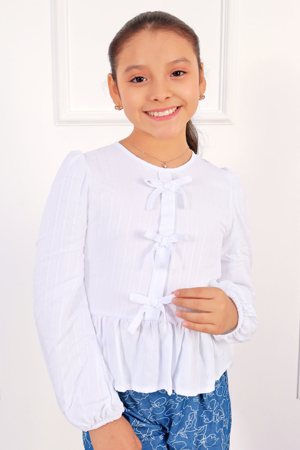 BLUSA LISTADA CON LASITOS EN PECHERA Y FALDON RECOGIDO