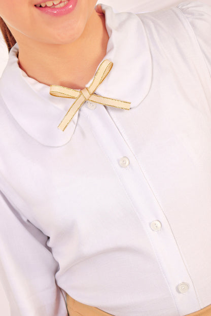 BLUSA CON CUELLO CAMISERO Y PUÑOS CON VOLANTES ELASTICADOS