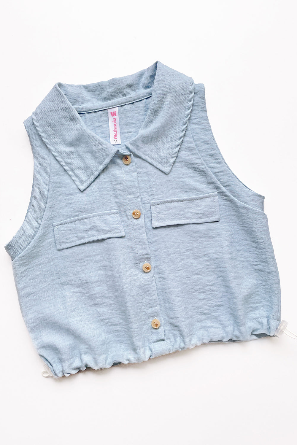 Blusa abierta manga cero con cuello camisero y elasticado en basta