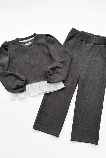 CONJUNTO CHOMPERO CON MANGAS ABULLONADAS Y FALDON DE LINO Y BUZO PALAZO