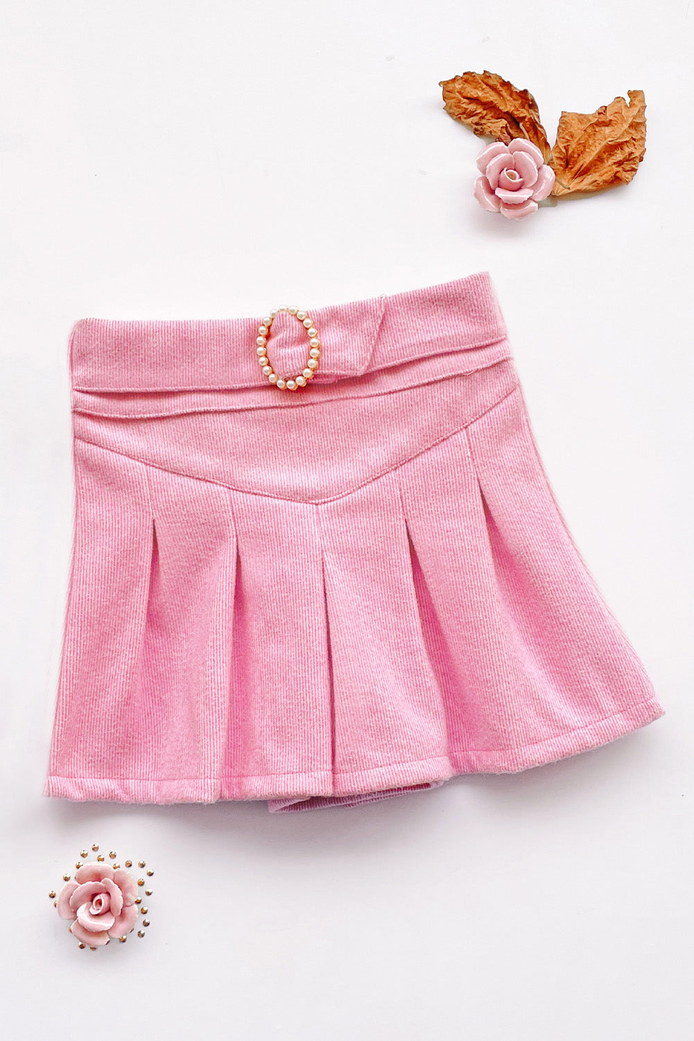 Falda short tableada con detalle en la pretina