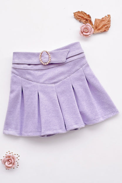 Falda short tableada con detalle en la pretina