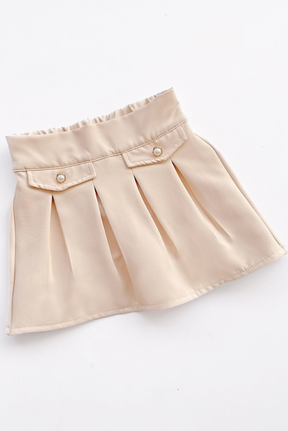 Falda tableada con elasticado en pretina