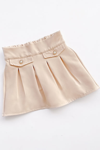 Falda tableada con elasticado en pretina