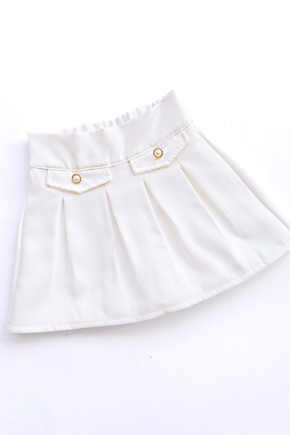 Falda tableada con elasticado en pretina