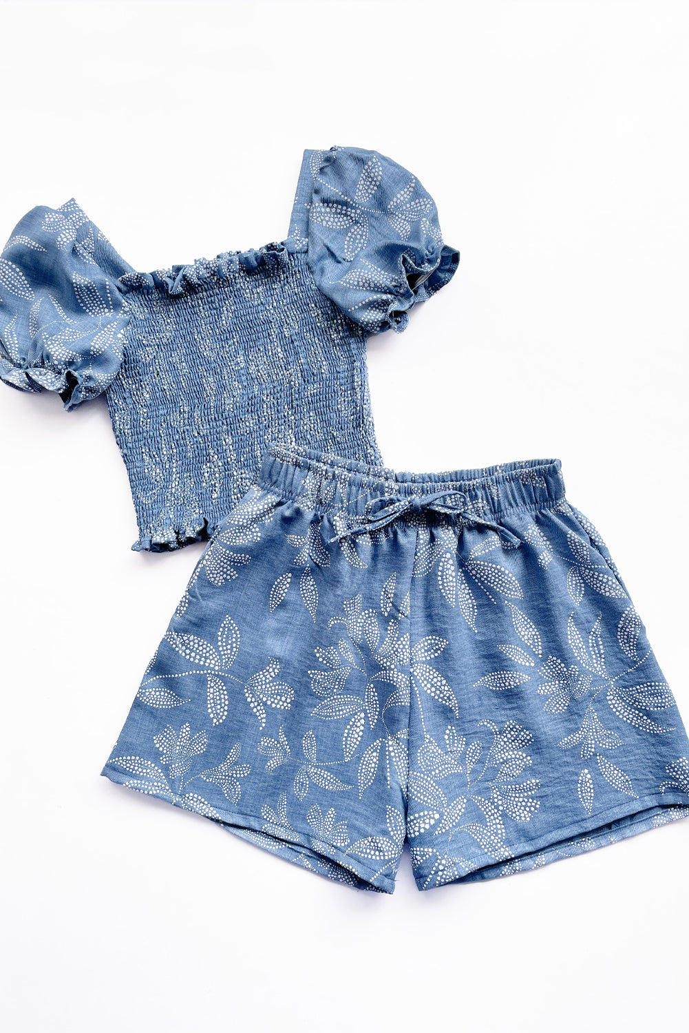 Set de blusa multiaguja y short con bolsillos