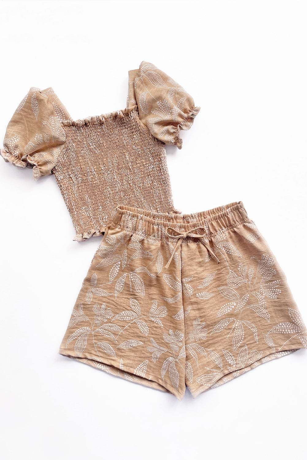 Set de blusa multiaguja y short con bolsillos