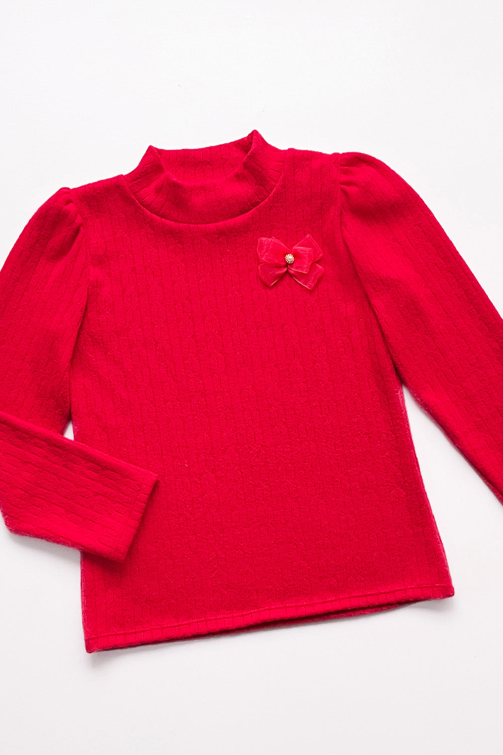 POLO CHOMPERO DE CUELLO ALTO CON LAZITO DE ORGANZA