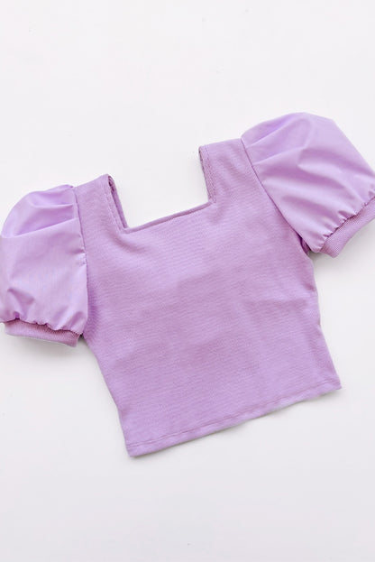 Top de rib de escote cuadrado con mangas tableadas y gran lazo en espada de popelina