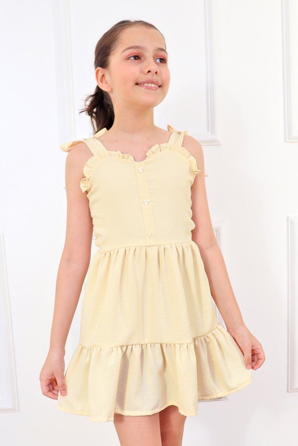 Vestido con elástico multiaguja y faldón dos tiempos con pechera en corpiño