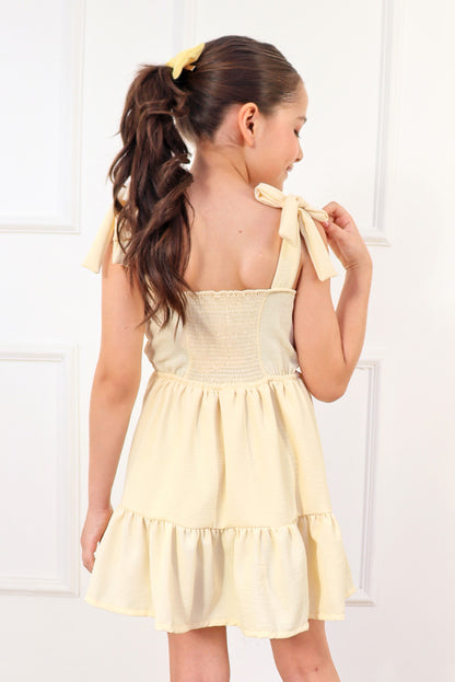 Vestido con elástico multiaguja y faldón dos tiempos con pechera en corpiño