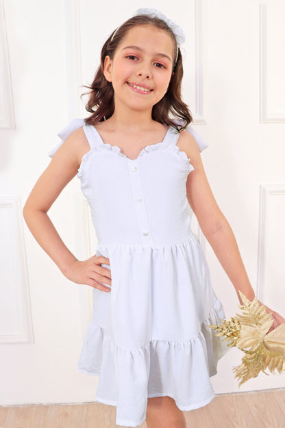 Vestido con elástico multiaguja y faldón dos tiempos con pechera en corpiño