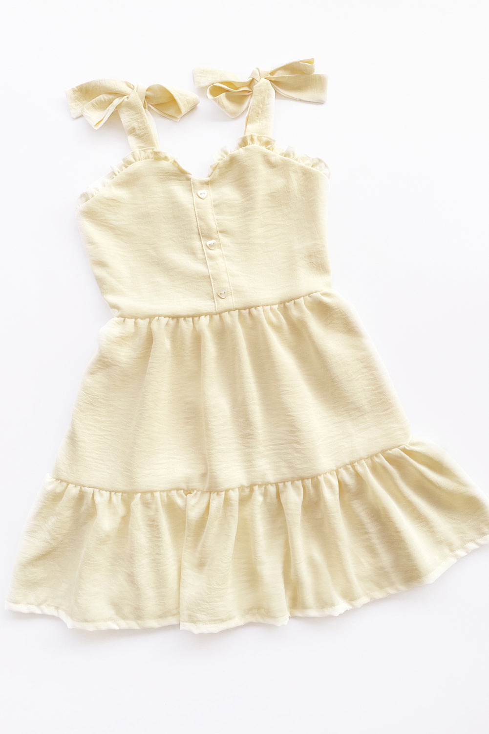 Vestido con elástico multiaguja y faldón dos tiempos con pechera en corpiño