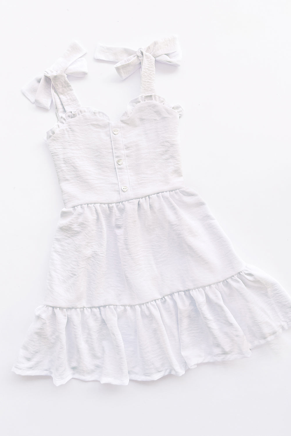 Vestido con elástico multiaguja y faldón dos tiempos con pechera en corpiño