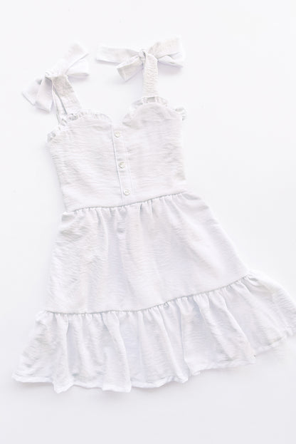 Vestido con elástico multiaguja y faldón dos tiempos con pechera en corpiño